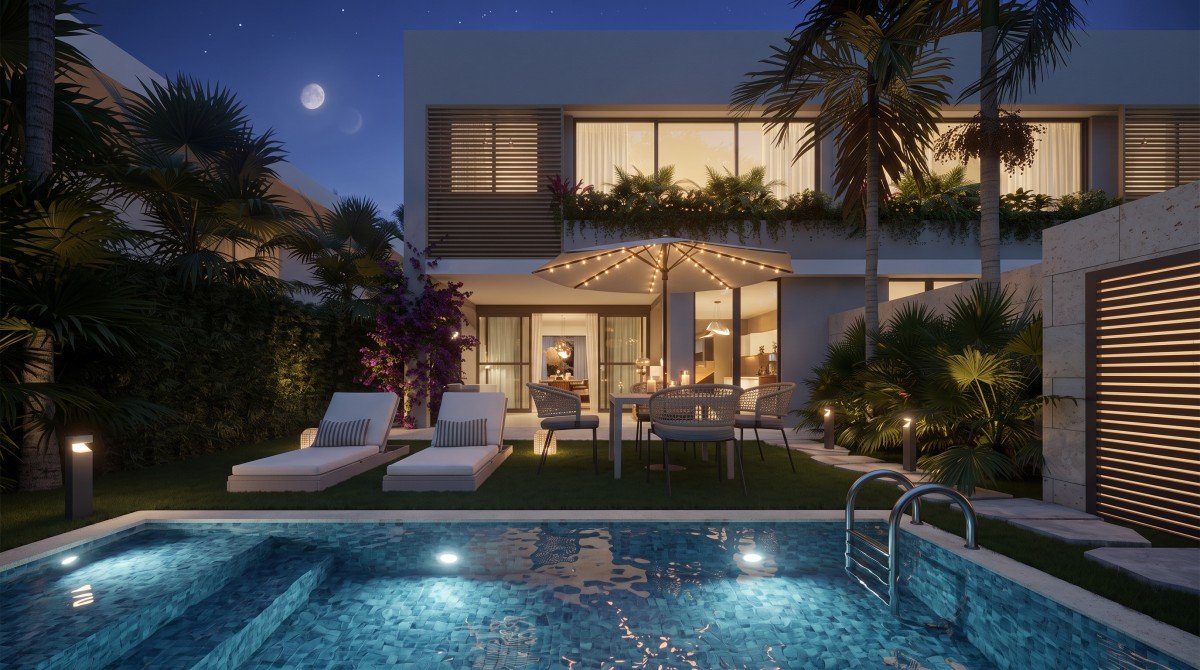 Piscina y jardín de Takuma Luxury Villas al anochecer